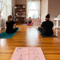 The Syracuse Yoga Collective logo