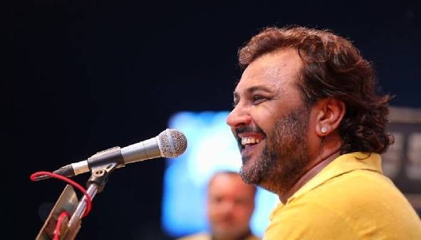 Kirtidan Gadhvi performing live on stage during a Navratri Garba night
